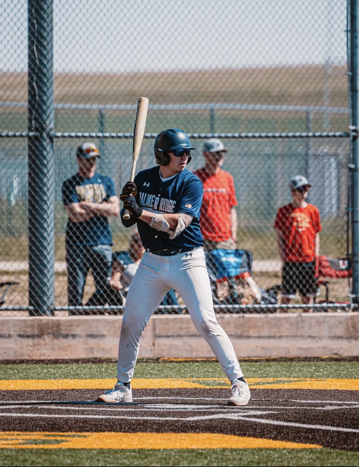 Baseball athlete in a batting stance at the plate