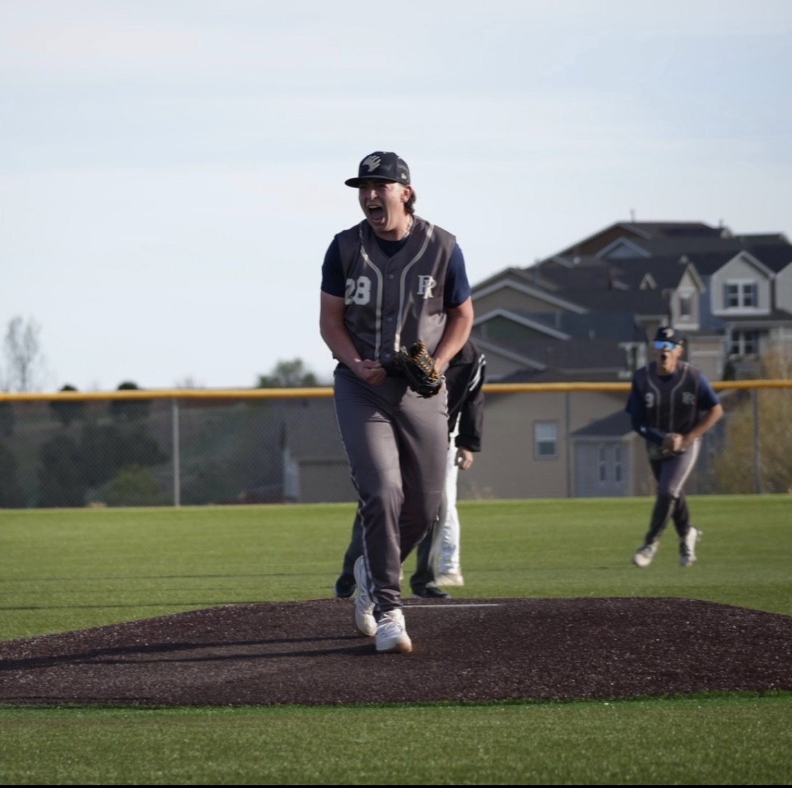 Baseball pitcher celebrating on the mound during a game